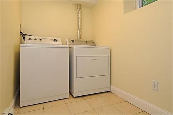 136-138 Middlesex Road, Unit B Chestnut Hill, MA 02467 - Photo 13 of 13 a utility room with dryer and washer