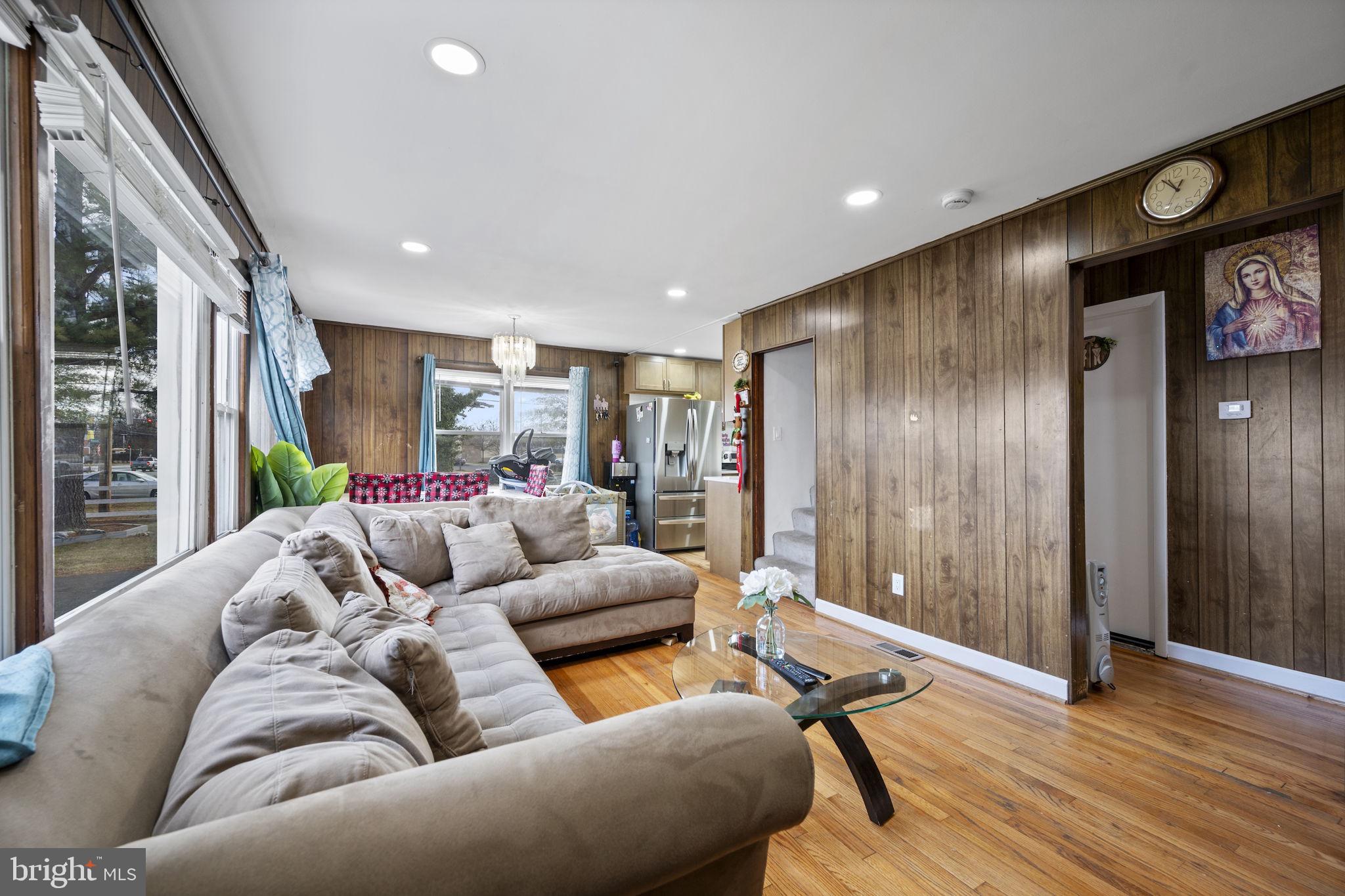 7715 Old Battle Grove Road Dundalk, MD 21222 - Photo 2 of 61 a living room with furniture and a wooden floor