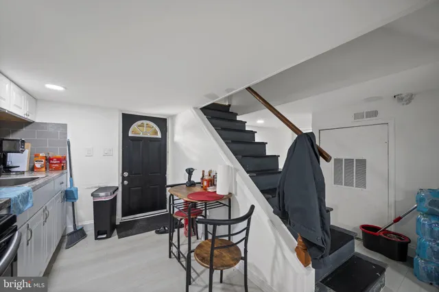 a kitchen with a sink cabinets and appliances