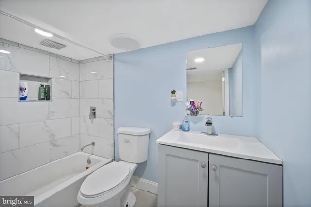 a bedroom with a bed and a flat screen television