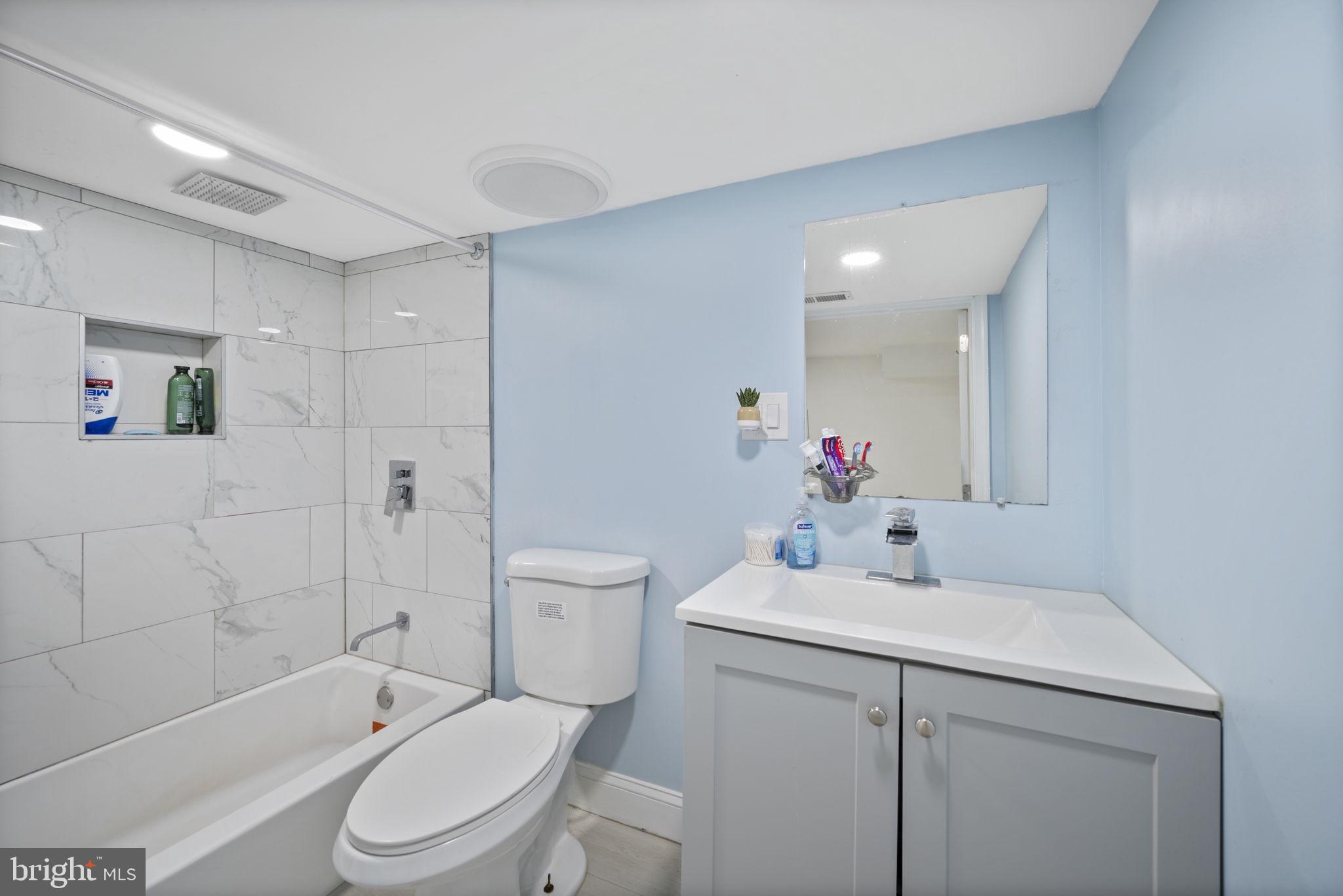 7715 Old Battle Grove Road Dundalk, MD 21222 - Photo 29 of 61 a bathroom with a sink toilet and shower