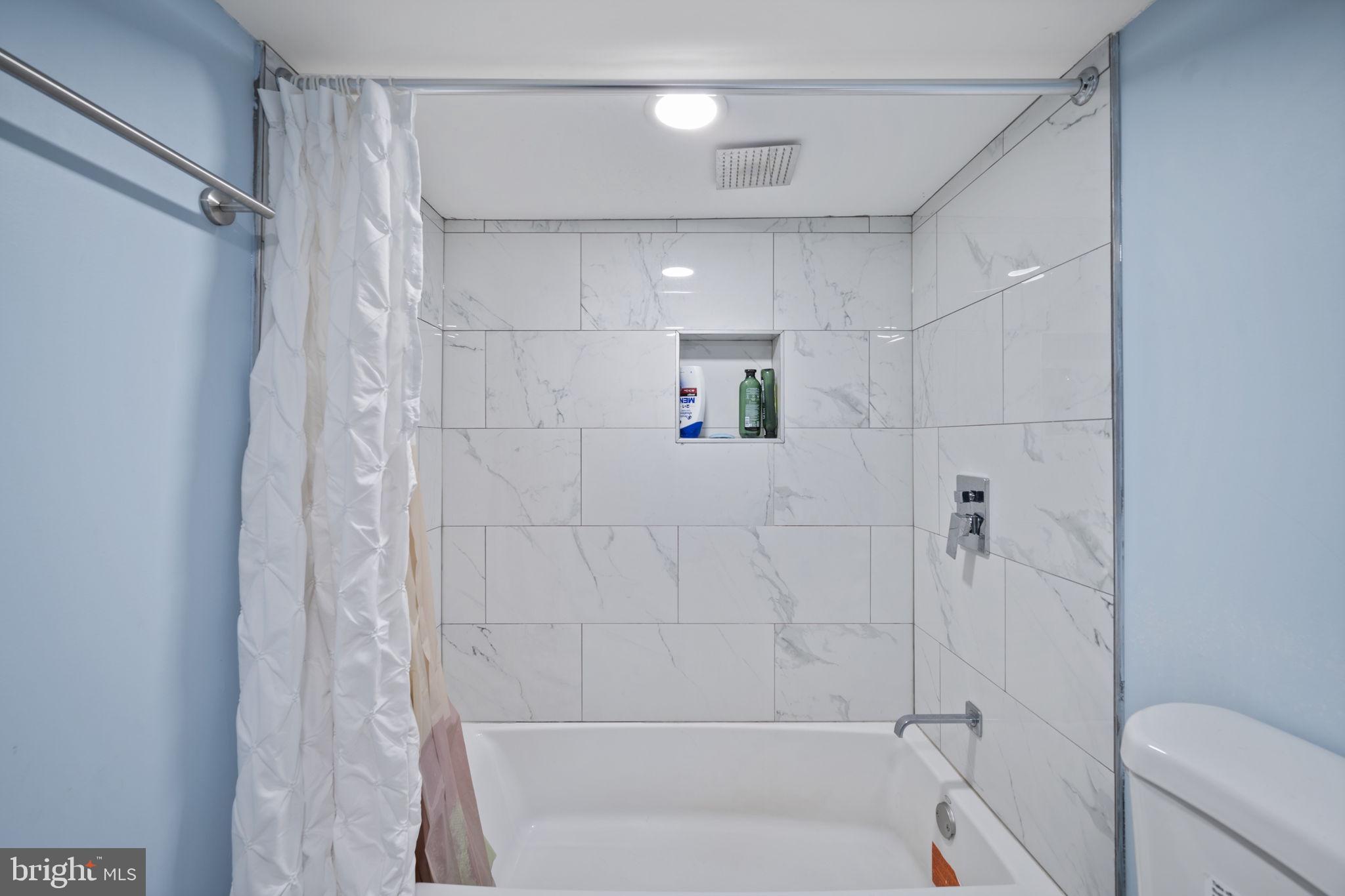 7715 Old Battle Grove Road Dundalk, MD 21222 - Photo 30 of 61 a bathroom with a shower and toilet