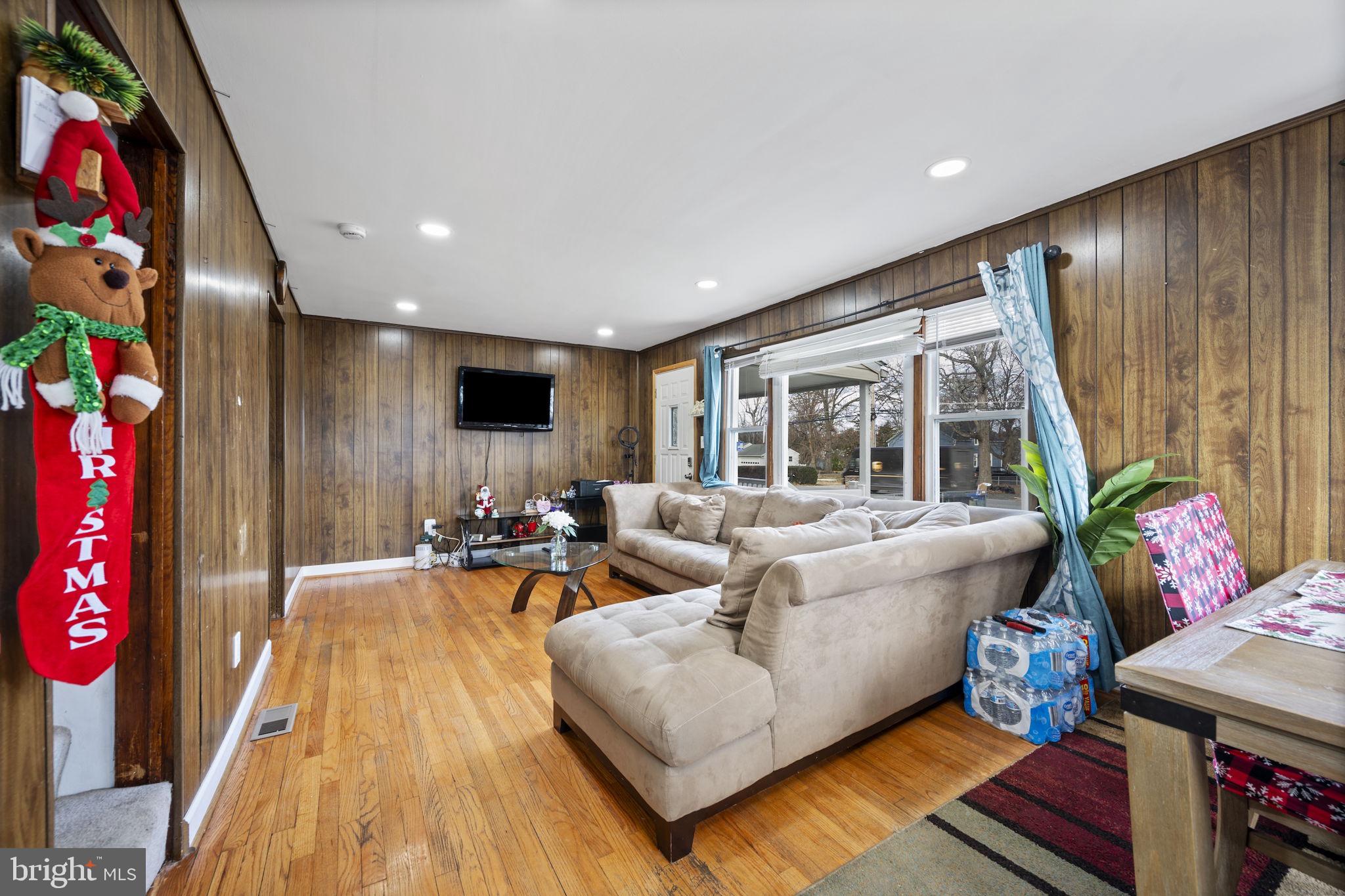 7715 Old Battle Grove Road Dundalk, MD 21222 - Photo 3 of 61 a living room with furniture and a flat screen tv