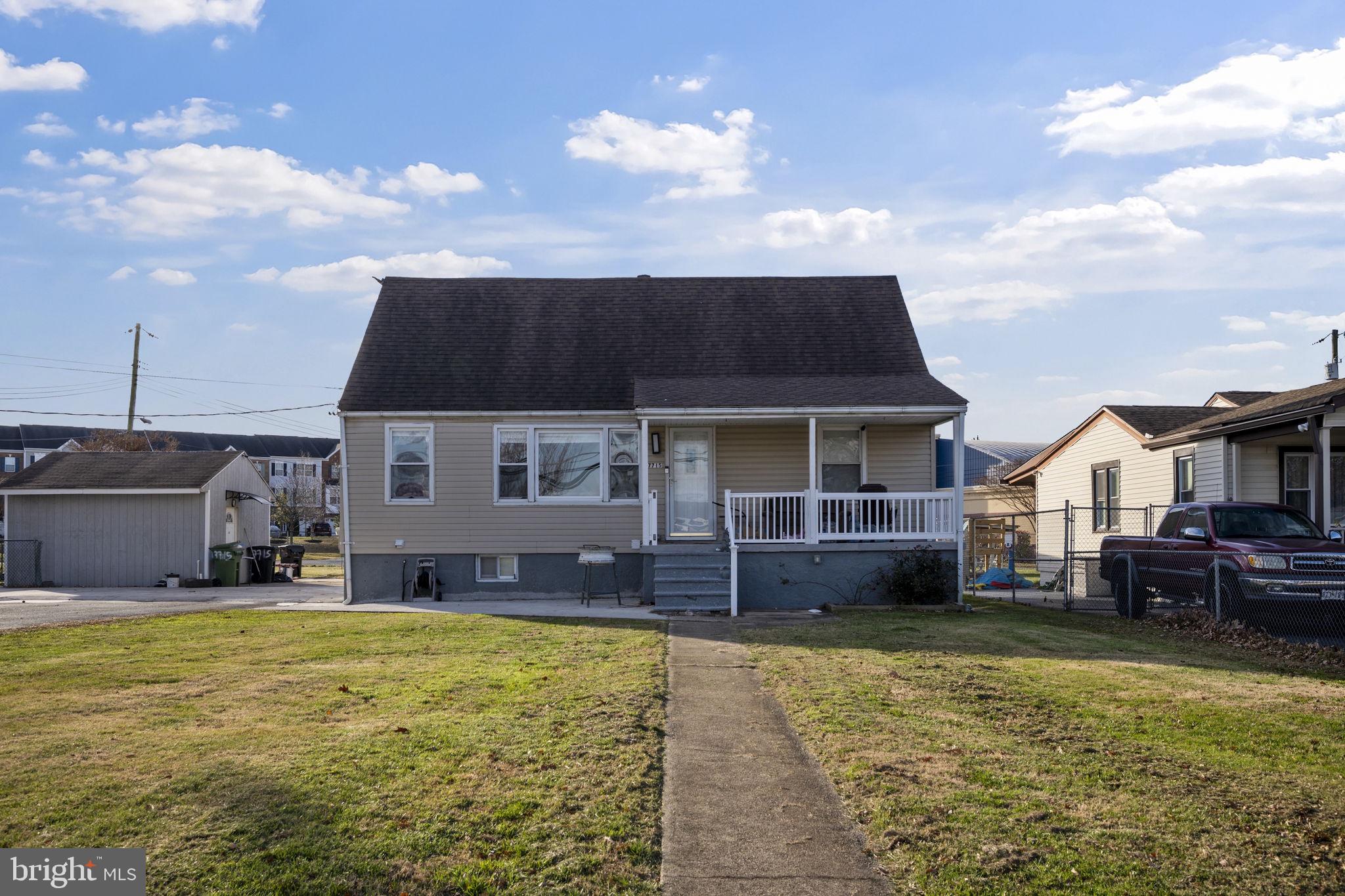 7715 Old Battle Grove Road Dundalk, MD 21222 - Photo 35 of 61 a front view of a house with a yard