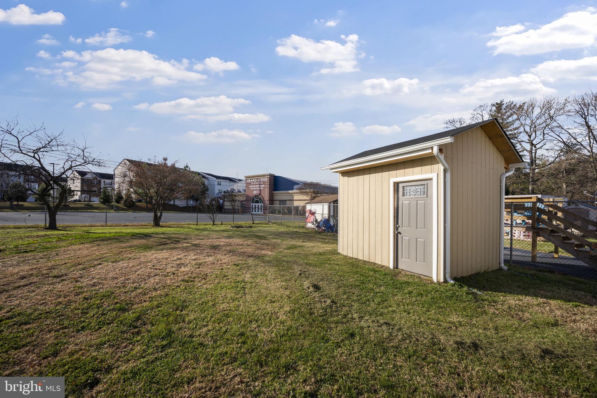 7715 Old Battle Grove Road Dundalk, MD 21222 - Photo 40 of 61 a view of a house with a yard and garage