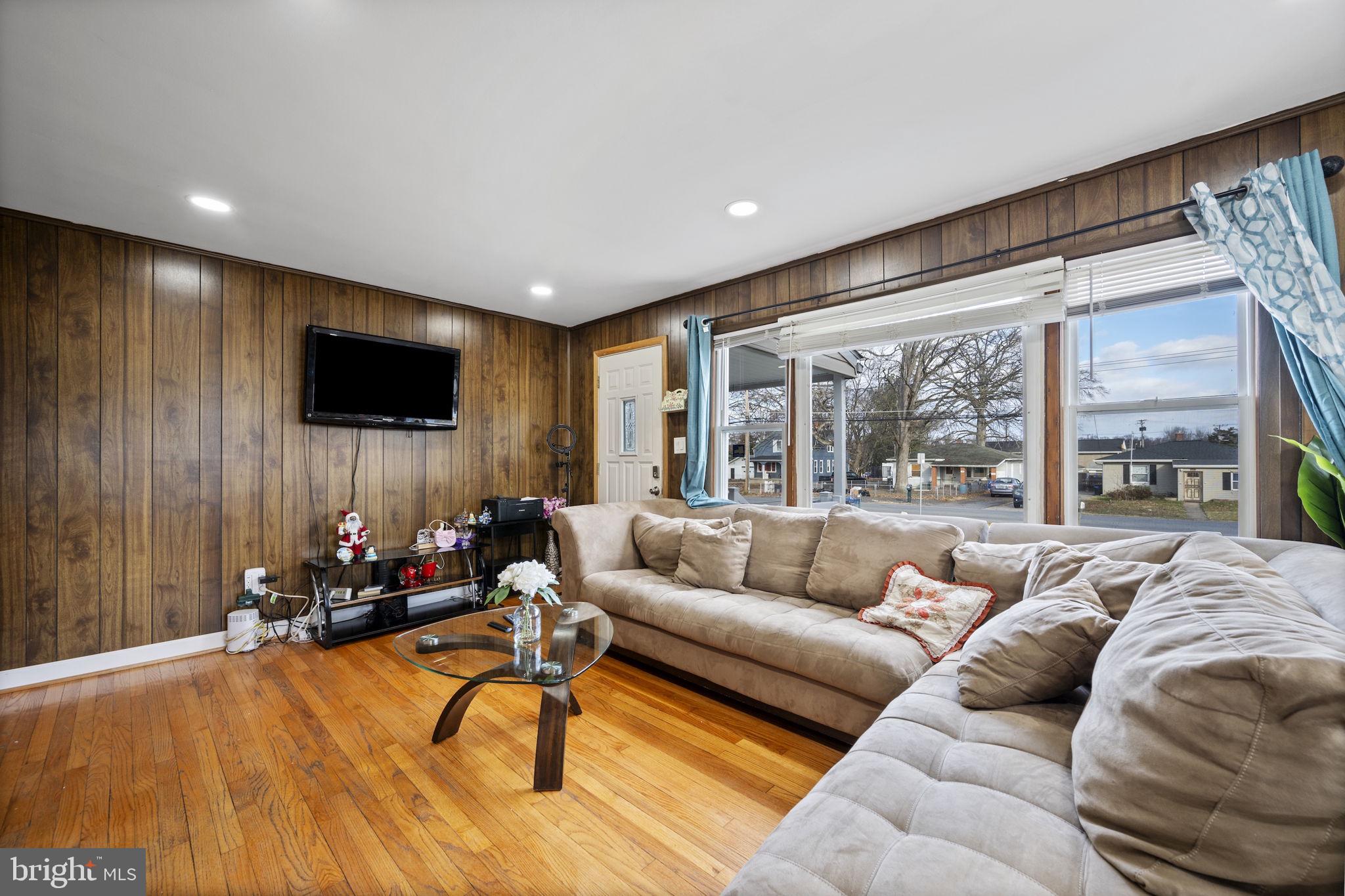 7715 Old Battle Grove Road Dundalk, MD 21222 - Photo 4 of 61 a living room with furniture and a flat screen tv