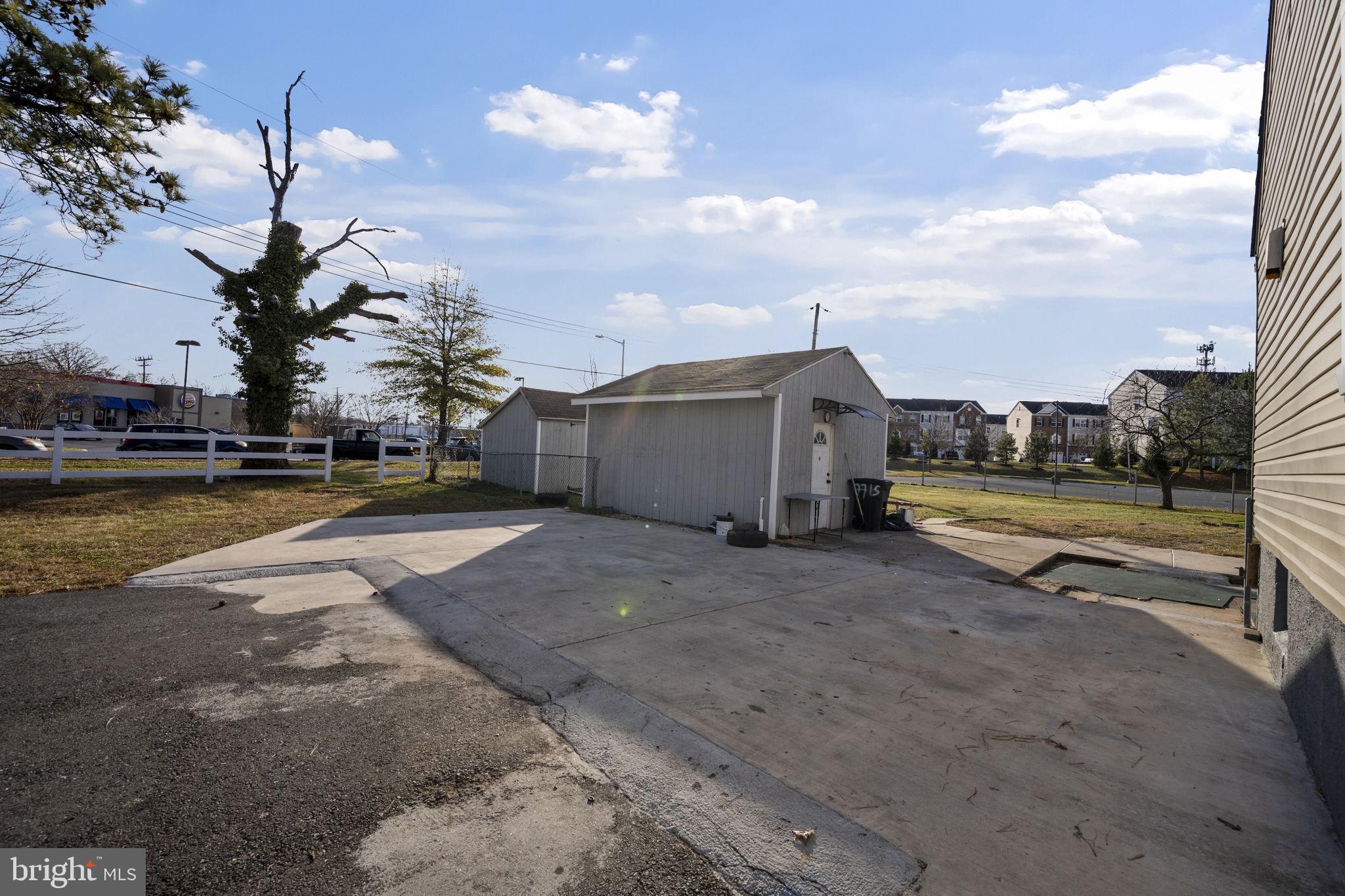 7715 Old Battle Grove Road Dundalk, MD 21222 - Photo 41 of 61 a view of a house with a yard and sitting area