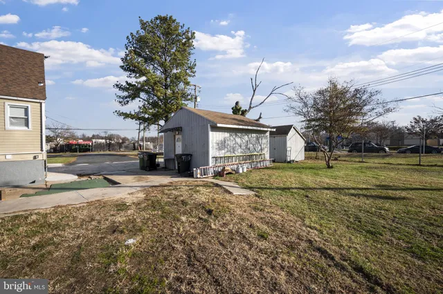 an aerial view of a swimming pool patio and outdoor seating