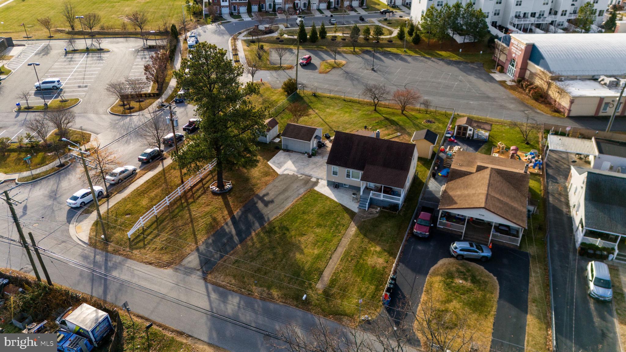 7715 Old Battle Grove Road Dundalk, MD 21222 - Photo 49 of 61 an aerial view of a house with swimming pool