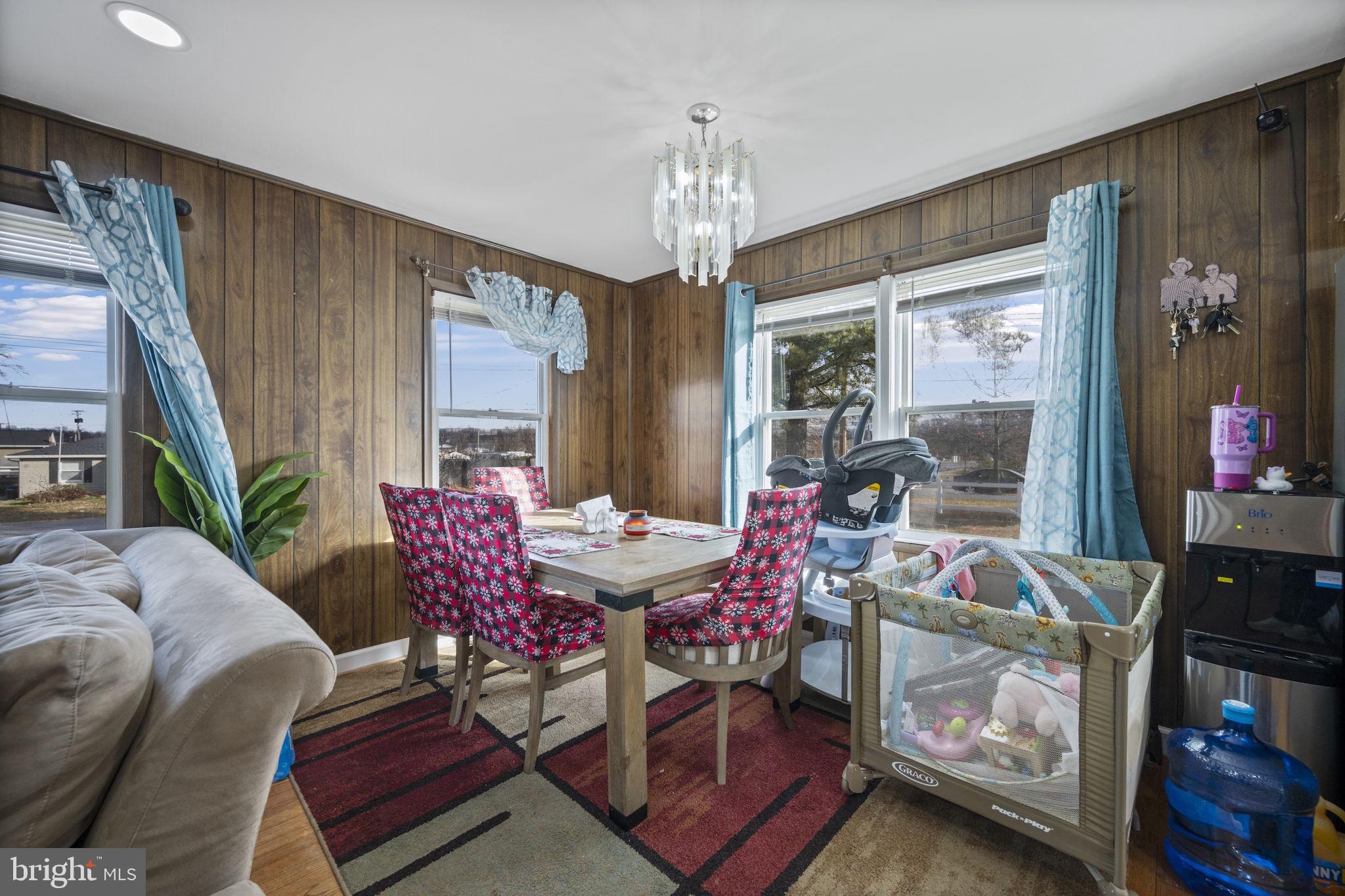 7715 Old Battle Grove Road Dundalk, MD 21222 - Photo 5 of 61 a view of a dining room with furniture window and outside view
