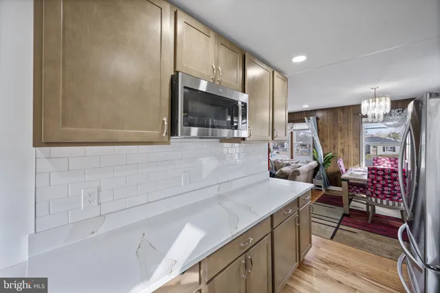 a kitchen that has a sink and a stove in it