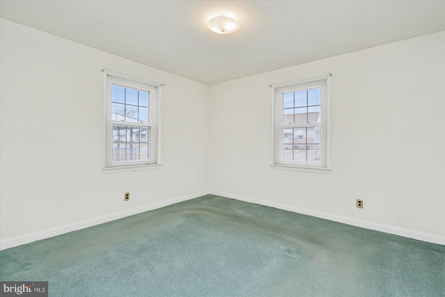 1528 Leslie Road Baltimore, MD 21222 - Photo 19 of 33 an empty room with windows