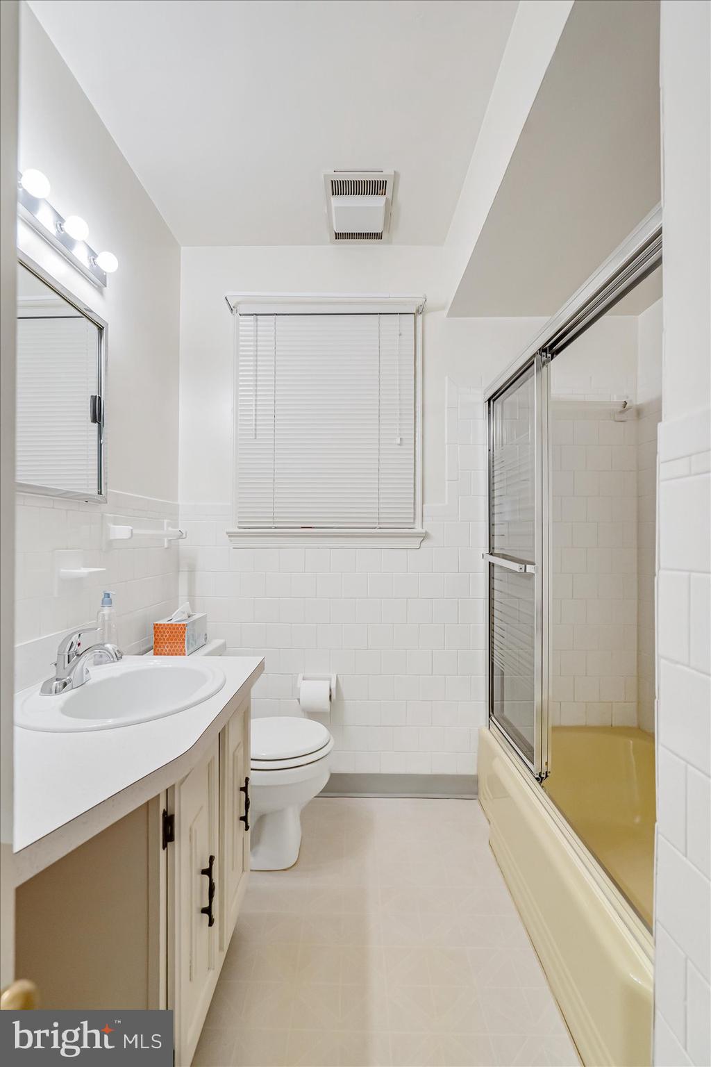 1528 Leslie Road Baltimore, MD 21222 - Photo 23 of 33 a bathroom with a sink a toilet and shower