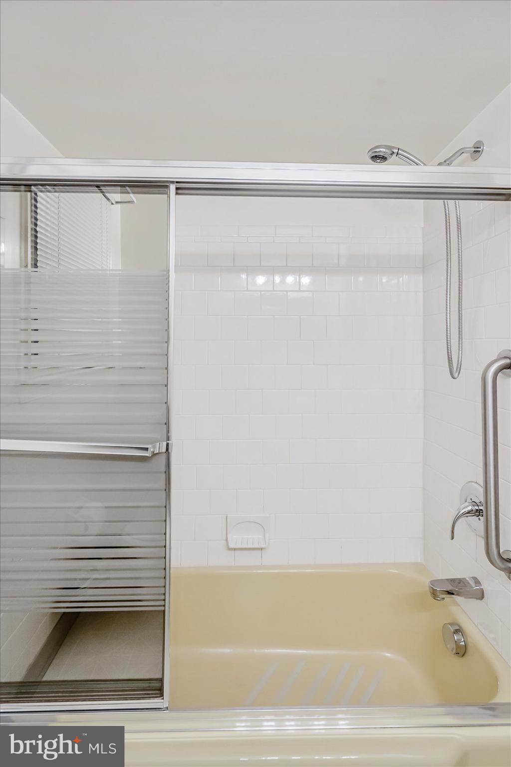 1528 Leslie Road Baltimore, MD 21222 - Photo 24 of 33 a bathroom with a shower and a bathtub