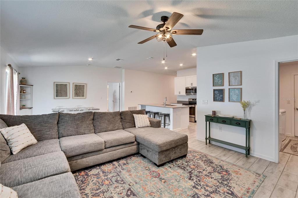 272 Pershing Street Bartow, FL 33830 - Photo 13 of 52 a living room with furniture and kitchen view