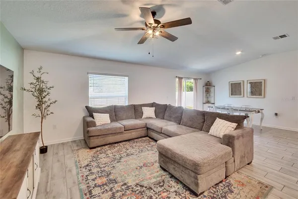 a living room with furniture and a window