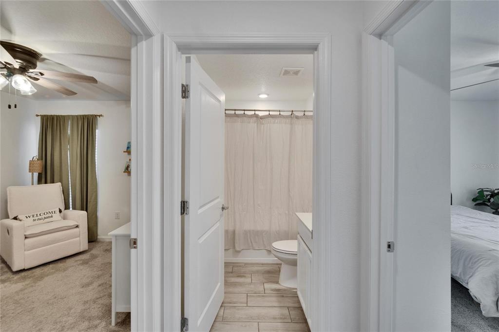 272 Pershing Street Bartow, FL 33830 - Photo 21 of 52 a bathroom with a sink a toilet and shower