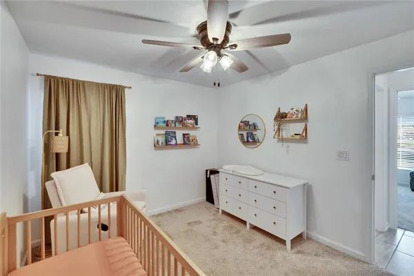 a bedroom with furniture and a chandelier