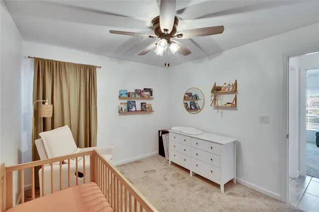 a bedroom with furniture and a chandelier