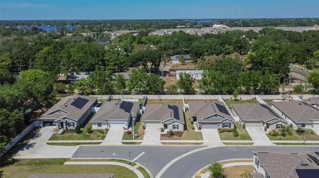 an aerial view of a house with a garden