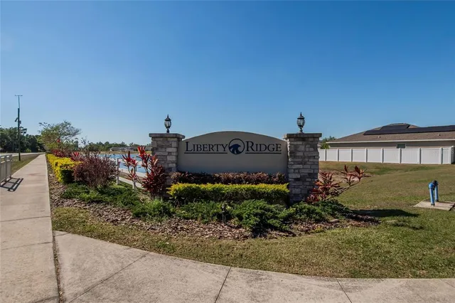 a view of a swimming pool with a yard