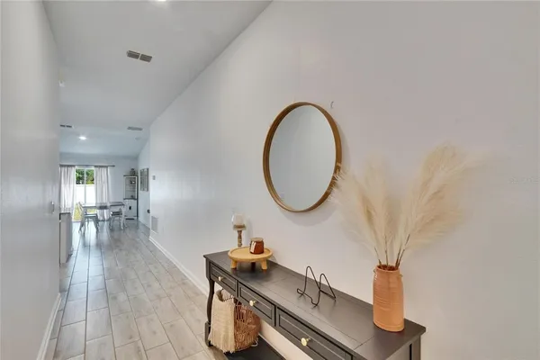 a room with furniture and a mirror