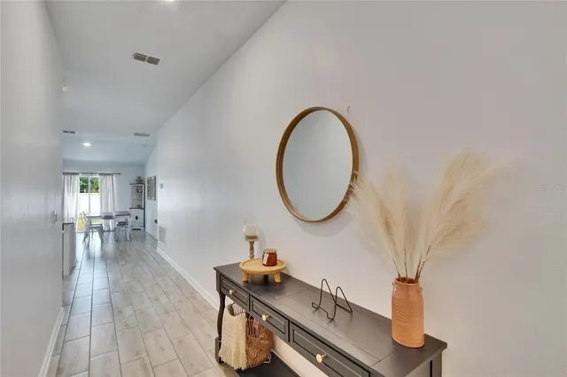 a room with furniture and a mirror