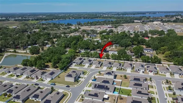 an aerial view of a house with lots of trees