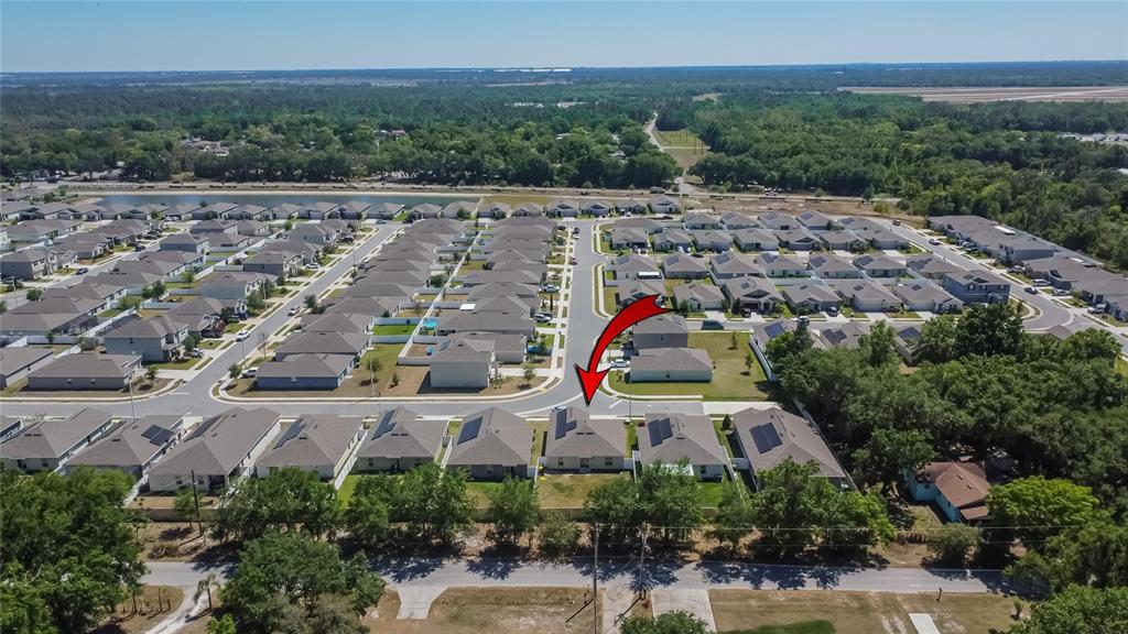 272 Pershing Street Bartow, FL 33830 - Photo 44 of 52 an aerial view of a house with a yard and lake view