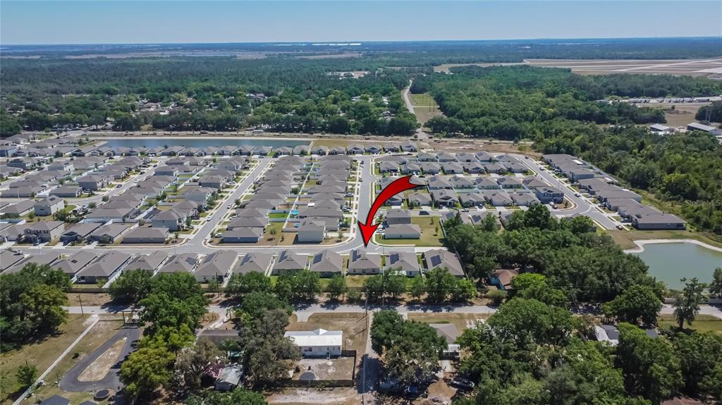 272 Pershing Street Bartow, FL 33830 - Photo 45 of 52 an aerial view of a house with lots of trees