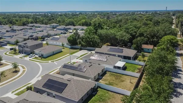 an aerial view of a house with a garden