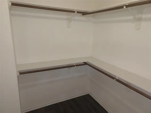 a view of an empty walk in closet