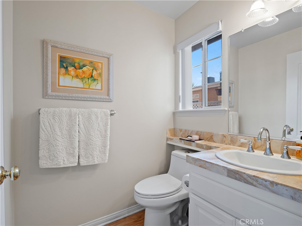 2517 Rockefeller Lane, Unit B Redondo Beach, CA 90278 - Photo 17 of 36 a bathroom with a toilet a sink and mirror