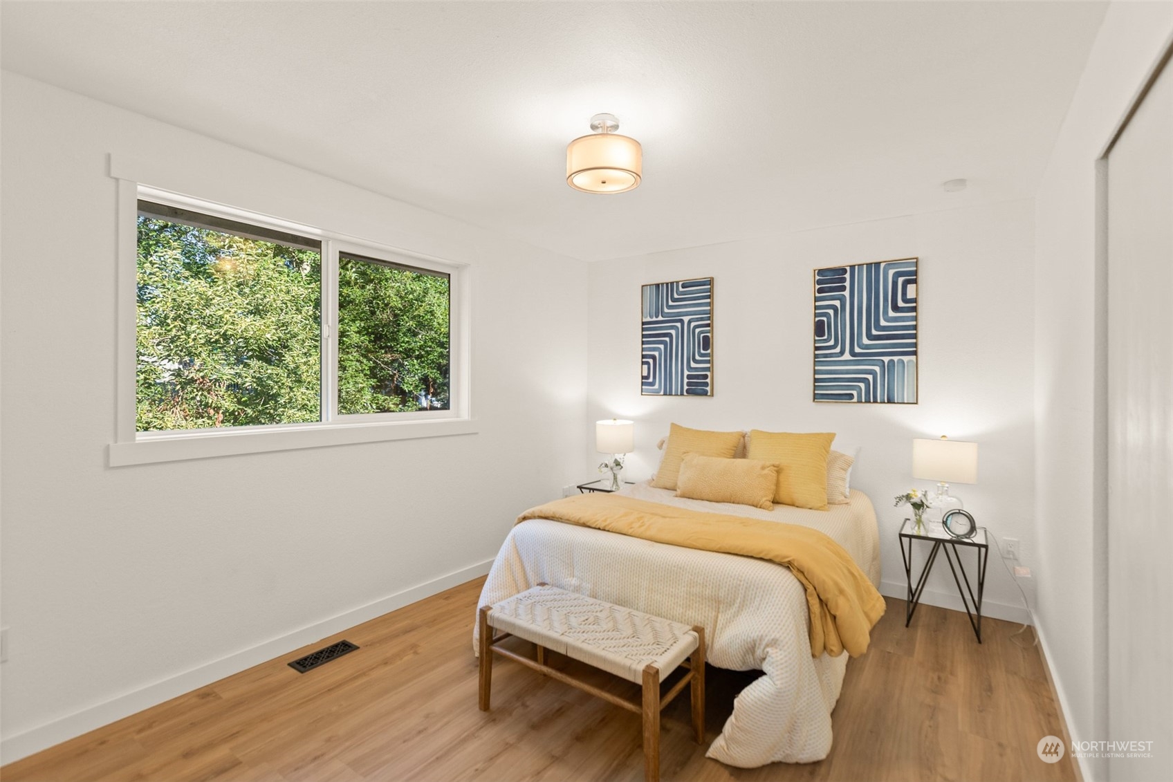 22612 20th Avenue Southeast Bothell, WA 98021 - Photo 20 of 35 a bed sitting in a bedroom next to a window