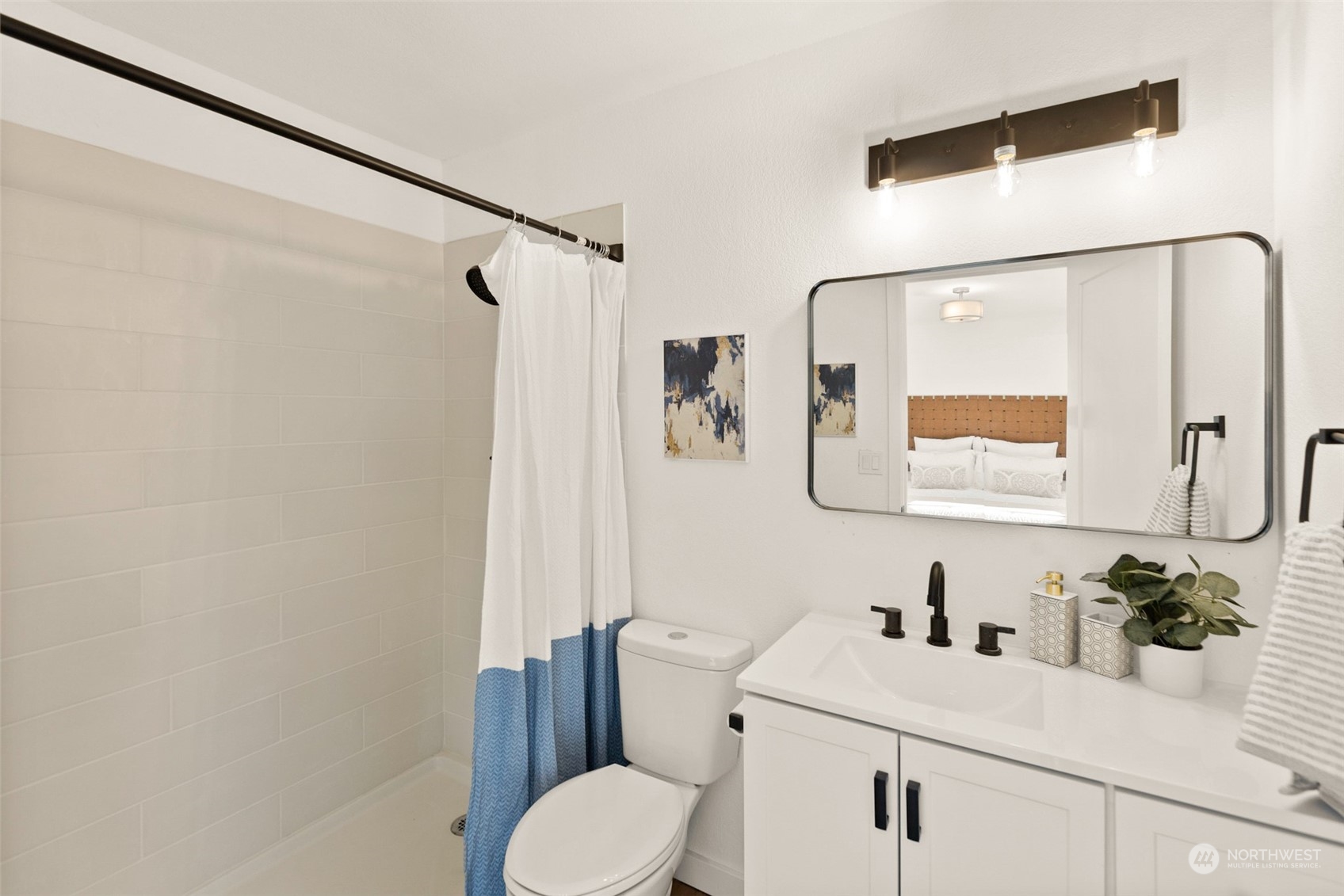 22612 20th Avenue Southeast Bothell, WA 98021 - Photo 23 of 35 a bathroom with a sink vanity mirror and toilet