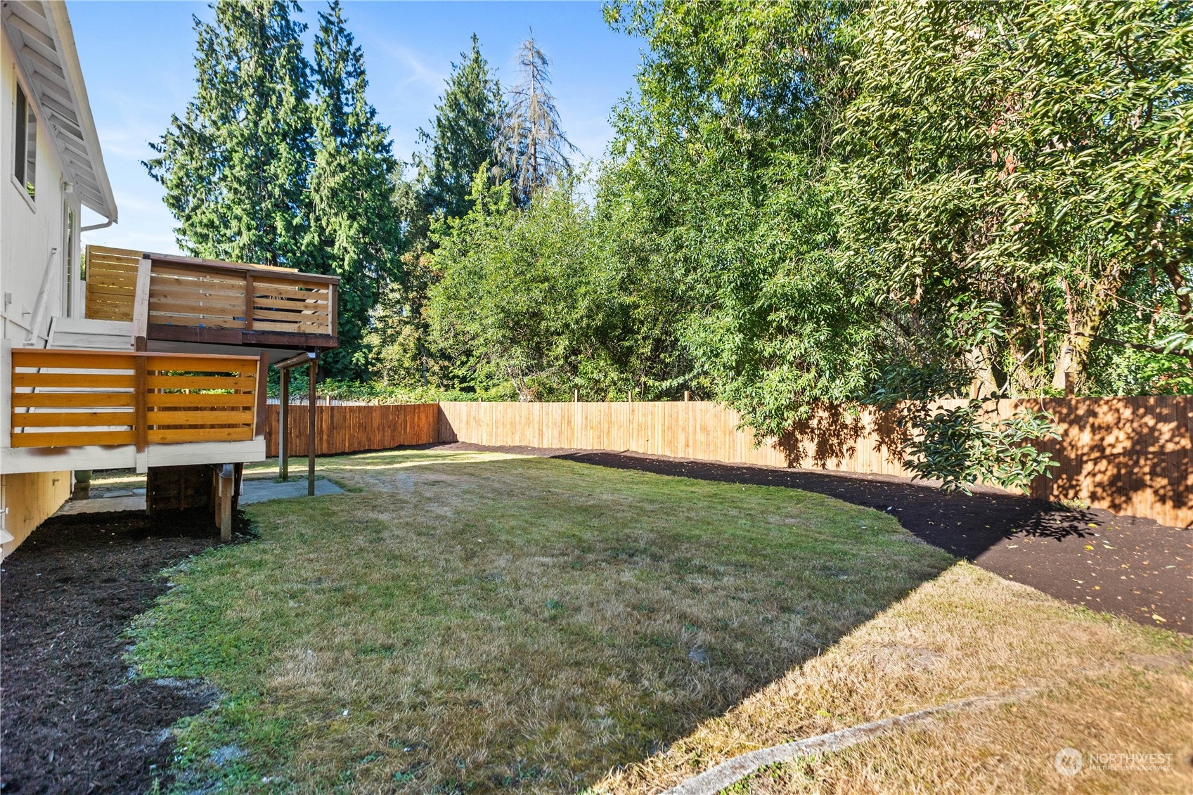 22612 20th Avenue Southeast Bothell, WA 98021 - Photo 34 of 35 a backyard of a house with lots of green space