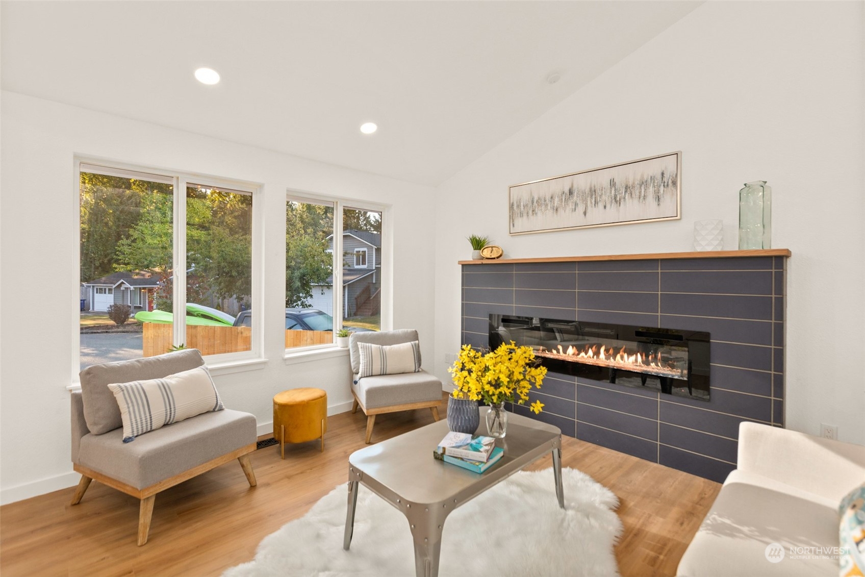 22612 20th Avenue Southeast Bothell, WA 98021 - Photo 4 of 35 a living room with furniture and a fireplace