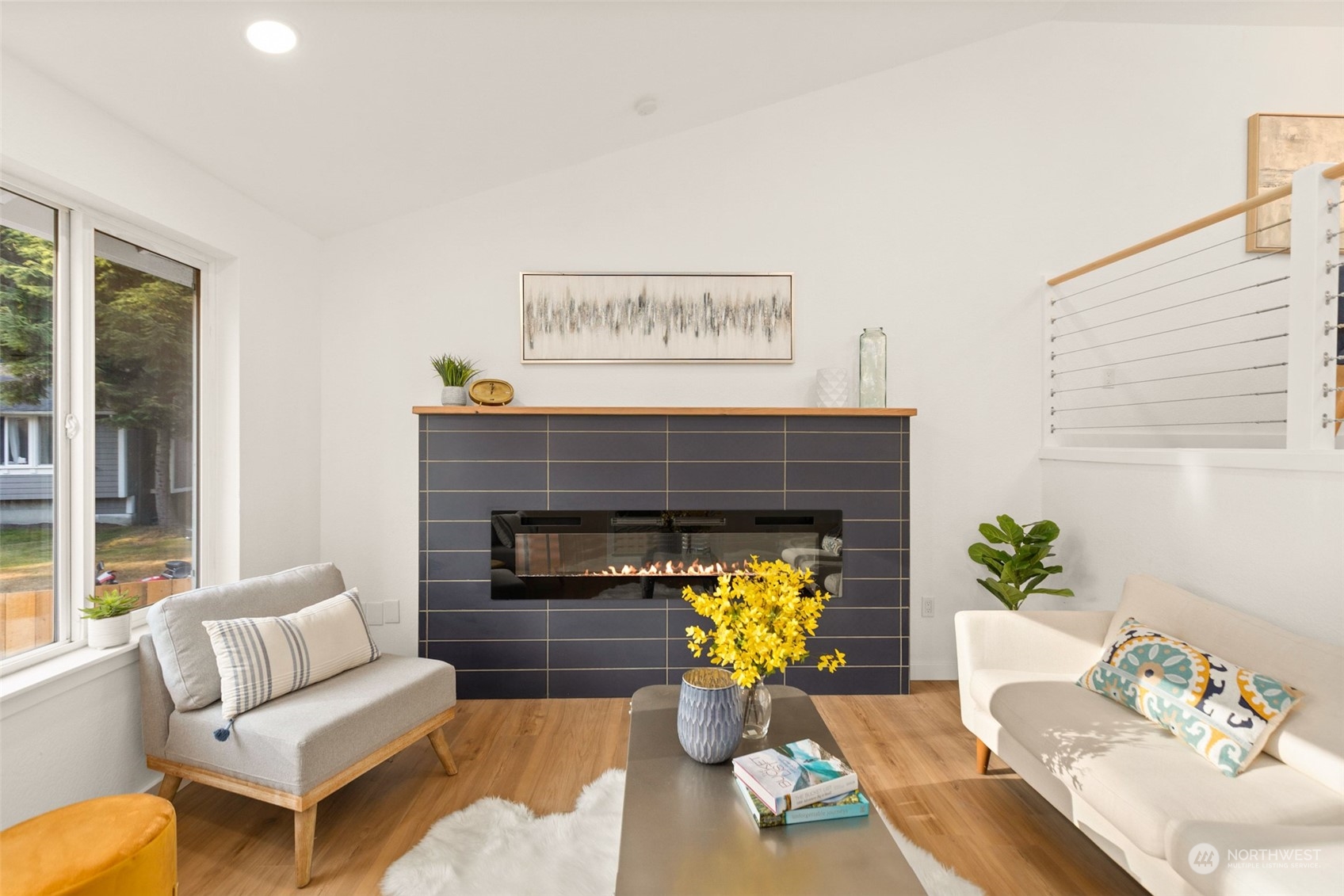 22612 20th Avenue Southeast Bothell, WA 98021 - Photo 5 of 35 a living room with furniture and a fireplace