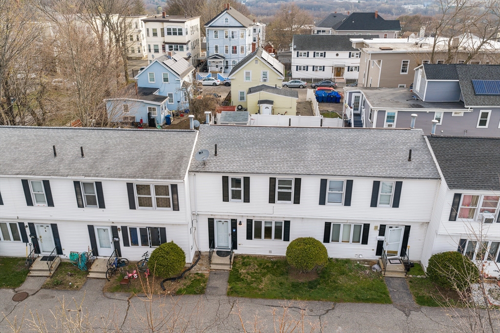 22 Pleasant Street, Unit D Lawrence, MA 01841 - Photo 2 of 32 a front view of a building with garden
