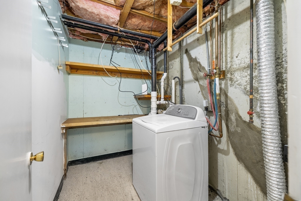 22 Pleasant Street, Unit D Lawrence, MA 01841 - Photo 24 of 32 a utility room with dryer and washer