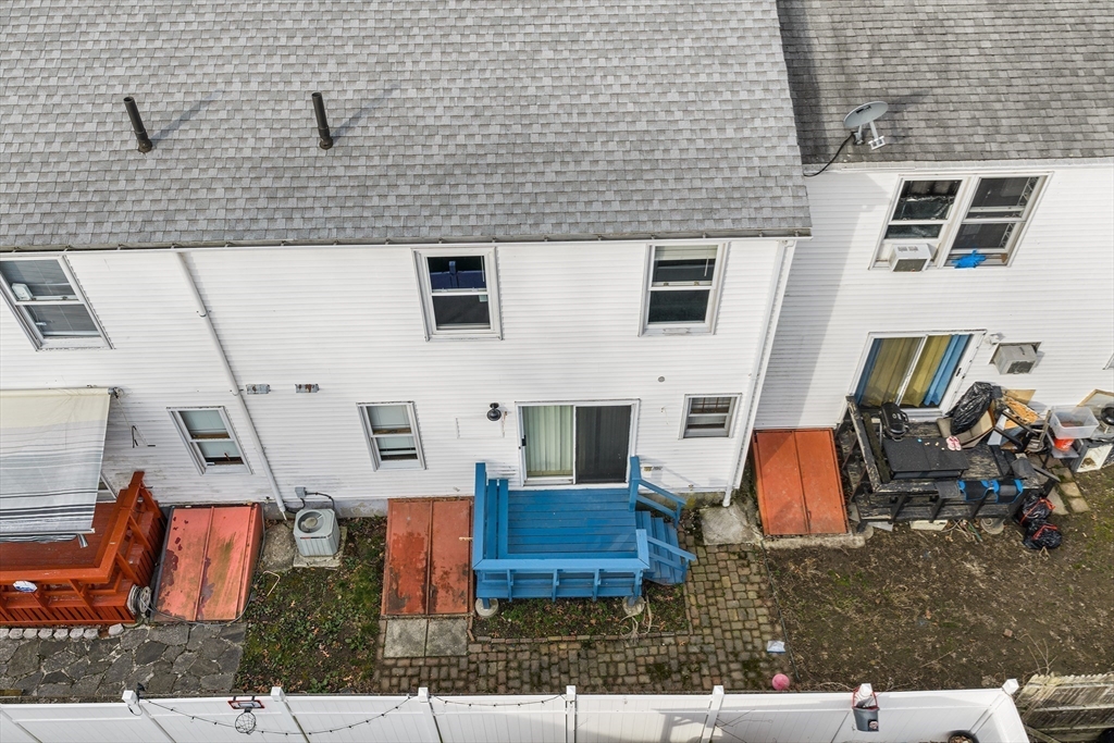 22 Pleasant Street, Unit D Lawrence, MA 01841 - Photo 29 of 32 an aerial view of residential houses with outdoor space