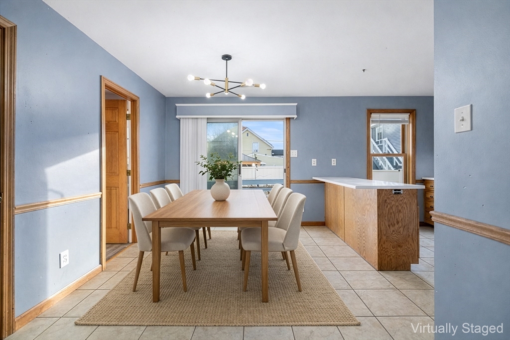 22 Pleasant Street, Unit D Lawrence, MA 01841 - Photo 6 of 32 a view of a dining room with furniture and window