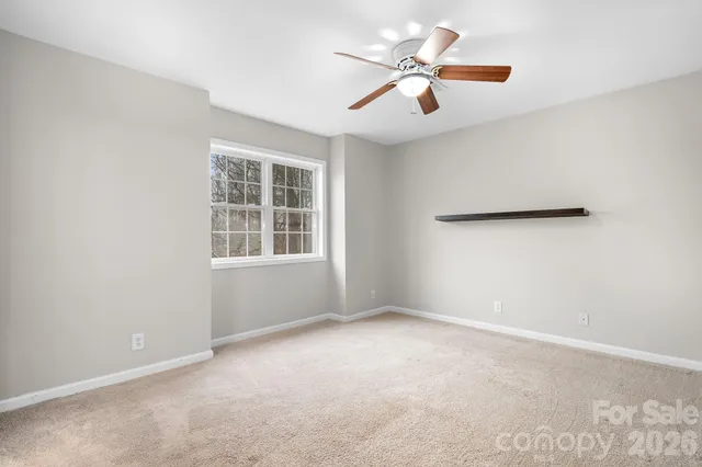 a white bath tub sitting next to a window