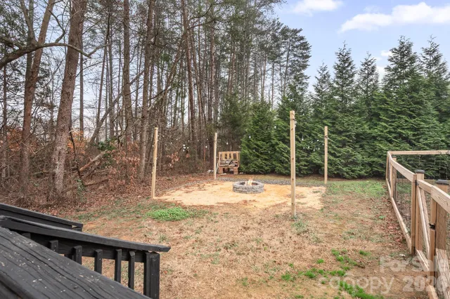 a backyard of house with swing and slide