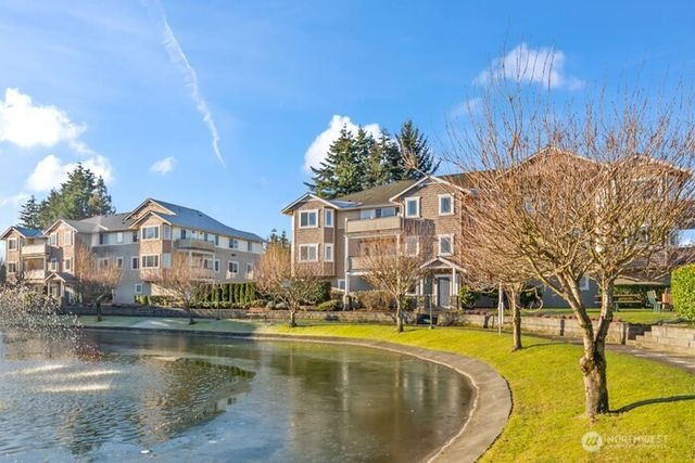 a building outdoor space with patio furniture and potted plants