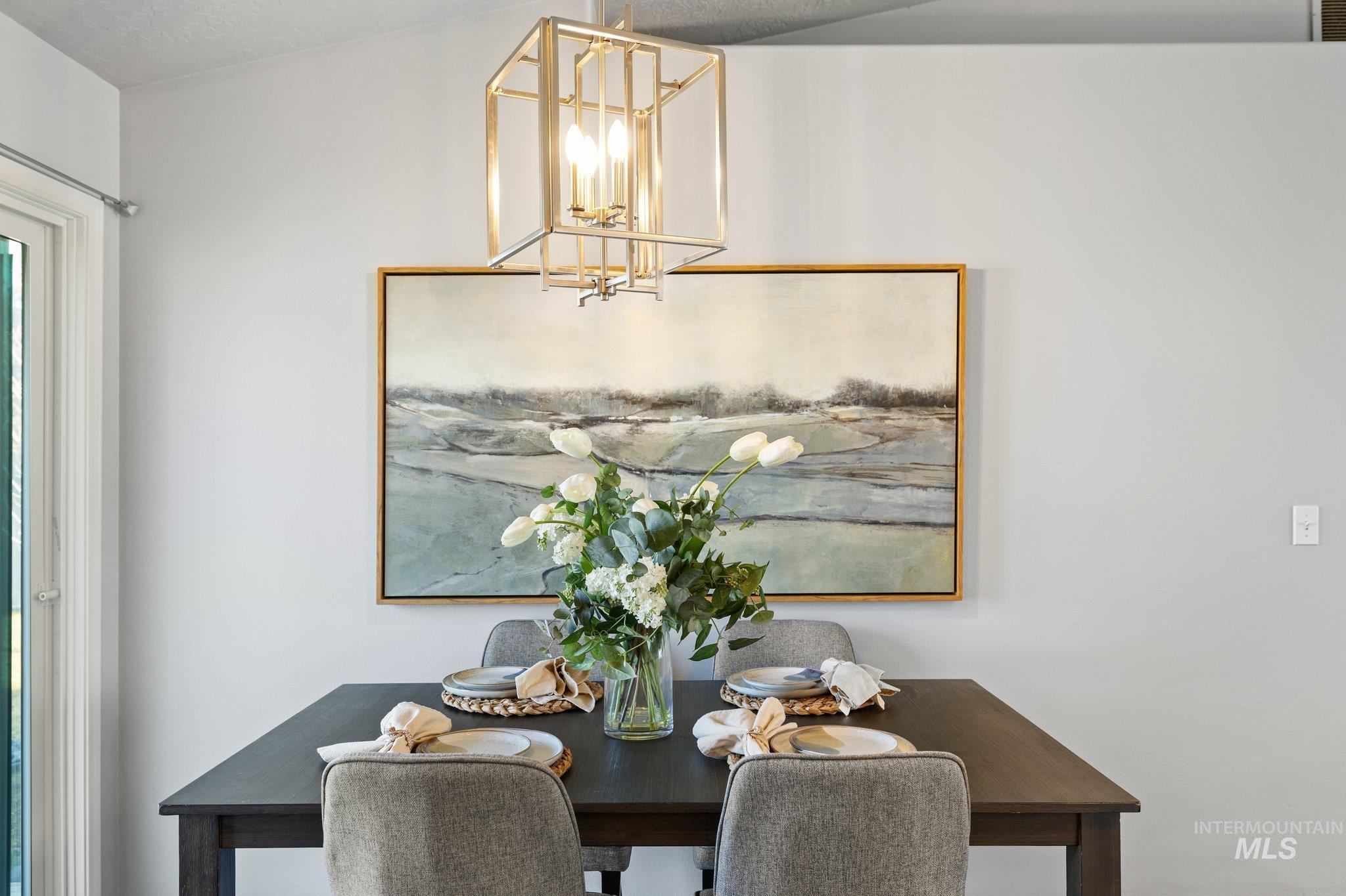 14250 Blue Ridge Street Caldwell, ID 83607 - Photo 16 of 33 Dining space featuring a chandelier