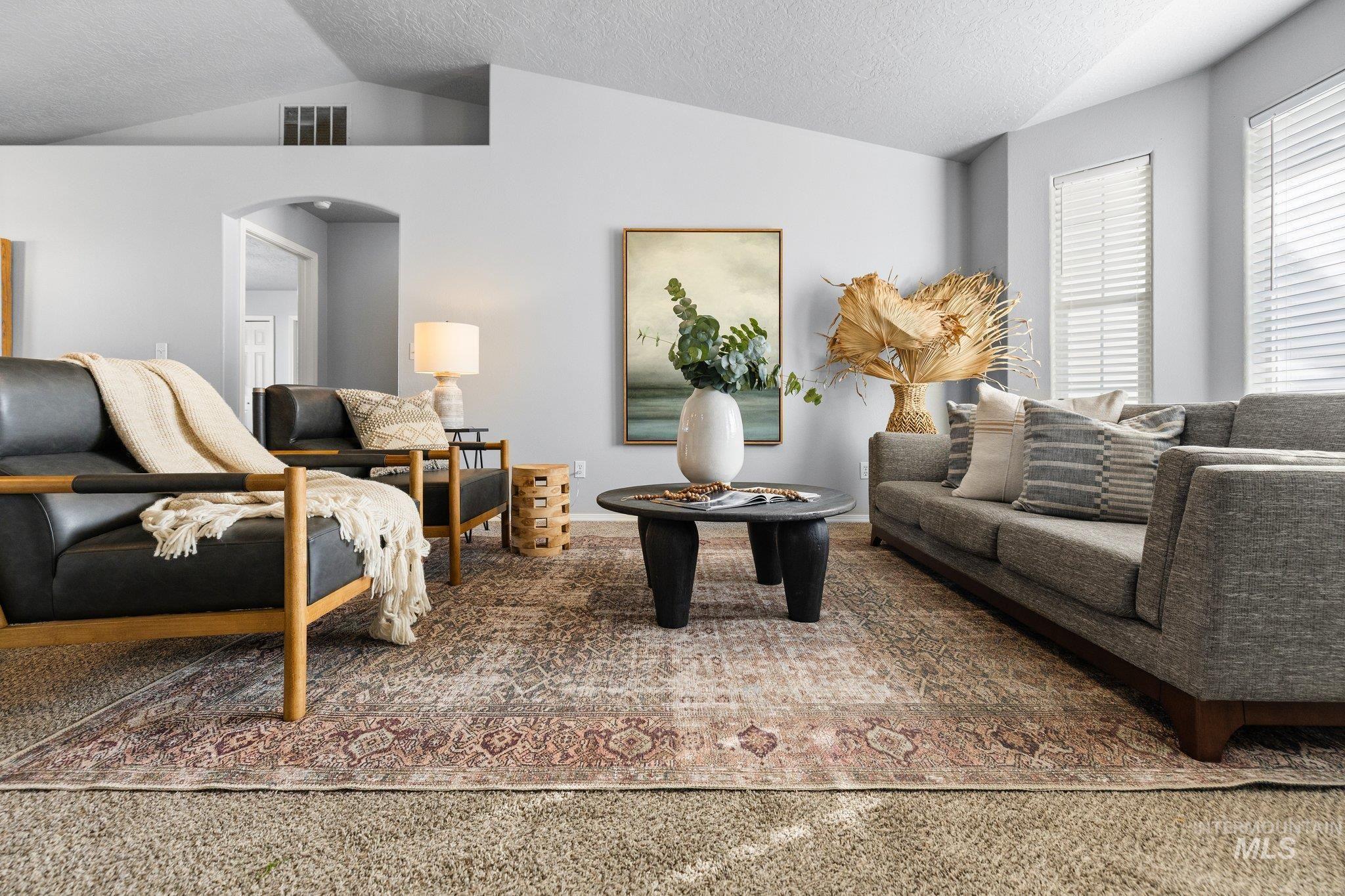14250 Blue Ridge Street Caldwell, ID 83607 - Photo 5 of 33 Carpeted living room with arched walkways