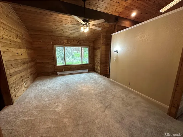 a view of room with a ceiling fan and window