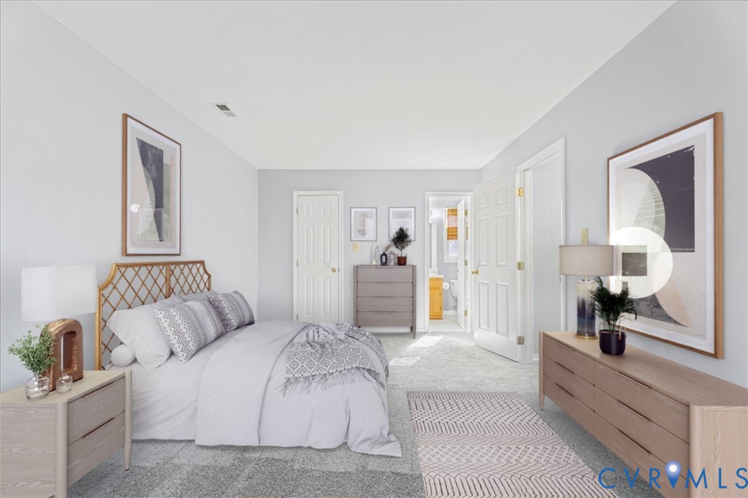 2739 Ridgeview Road Powhatan, VA 23139 - Photo 13 of 42 a spacious bedroom with a bed and a large mirror