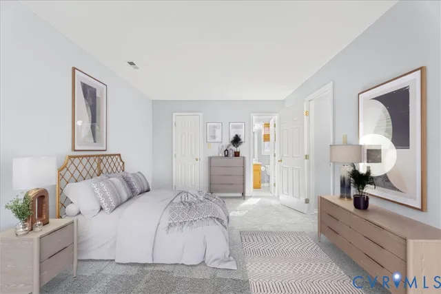 a spacious bedroom with a bed and a large mirror